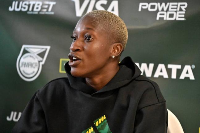Deneisha Blackwood speaks to the media during the Reggae Girlz press conference at the National Stadium yesterday.
