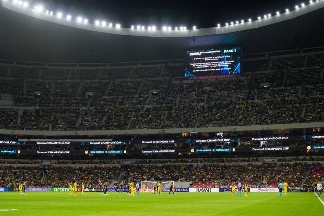 Referee Walter Lopez suspends a Concacaf Champions Cup quarter-final second leg football match between Mexico’s America and the United States’ Nashville SC in Mexico City on Tuesday, April 14, 2026. The suspension happened on account of discriminatory 