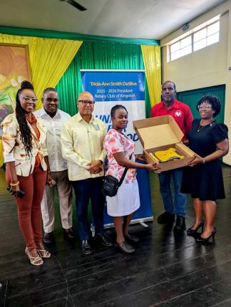 The Rotary Club of Kingston recently presented  an automated external  defibrillator (AED) to the Excelsior College.  From left are: Carolyn Gardner, president-elect, Rotary  Club of Kingston; Karsten Johnson, Assistant Governor, Rotary District 7020; Will