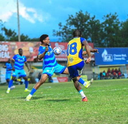
Harbour View’s Raje Ximines (right) kicks the ball as Odane Murray of Molynes United reacts during the Jamaica Premier League football match at Waterhouse Stadium on March 6. With three games to go in the preliminary round, both teams are locked in a ba