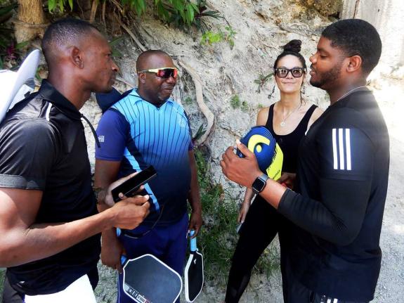 
From left: Andre Mesquita, Conrad Brown, Natalie Hughes and Kymani Daley in discussion ahead of familiarisation and coaching sessions at Ocho Rios High School for coaches from schools in St Ann and St Mary.