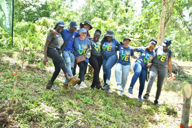 United Kingdom native and frequent visitor to Jamaica, Tracey Smith (third left), leads a group of volunteers in dancing after a recent tree-planting exercise in St. Ann. Sharing in the moment is Regional Public Relations Manager for Sandals Ocho Rios, Lyn