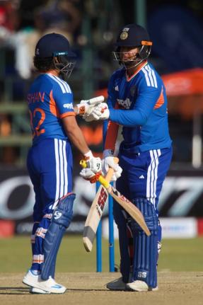 India’s batsman Vaibhav Sooryavanshi (right) celebrates reaching a half century with his teammate Ishan Kishan during the first T20 cricket match against Zimbabwe in Harare, Zimbabwe, yesterday.