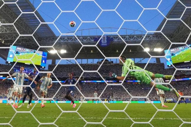 Argentina goalkeeper Emiliano Martinez (23) is beaten by a shot from Cape Verde’s Sidny Lopes Cabral (13) during the World Cup round-of-32 football match in Miami Gardens, Florida, Friday, July 3.