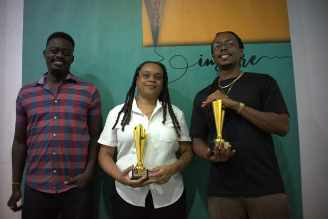 Dr Brian Kazzara, consultant psychiatrist at Bellevue Hospital, shares a moment with Lesley-Ann Wanliss, director of Bright Sparks and recipient of the Emerging Filmmaker Award, and Jordan Morris, director of Smile and winner of the Lens of Legacy Award. T
