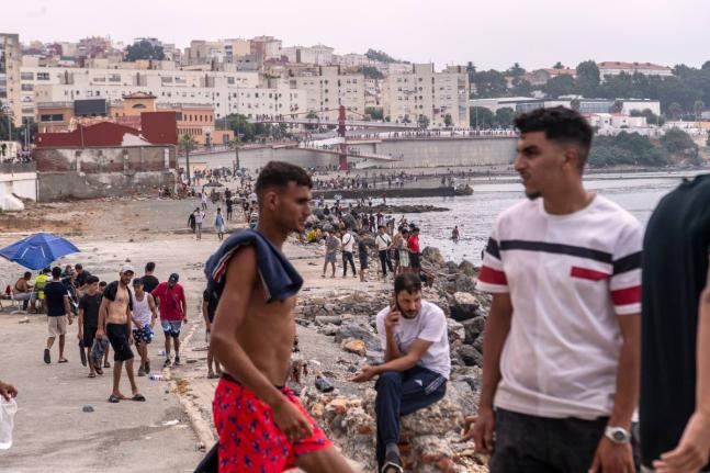 Migrants return to Morocco from the Spanish enclave of Ceuta.
