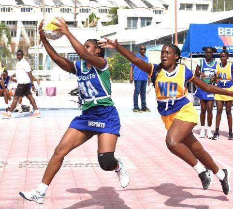 Remanique Edwards (left) of Denbigh High and Selena Grant (right) of Gaynstead High compete for the ball during their Insports Challenge Cup Netball semi-final at the Leila Robinson Court last Friday.