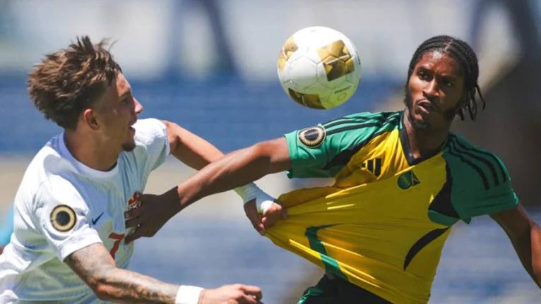Canada under-20s Marsel Bibishkov (left) and Jamaica’s Jaquan Brown tussle for the ball during a Concacaf  Under-20 Championship game at the Estadio Universitario BUAP in Puebla, Mexico on August 1. 