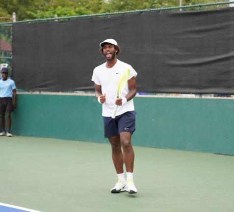 Andrew Fenty in action at the Liguanea Club yesterday.