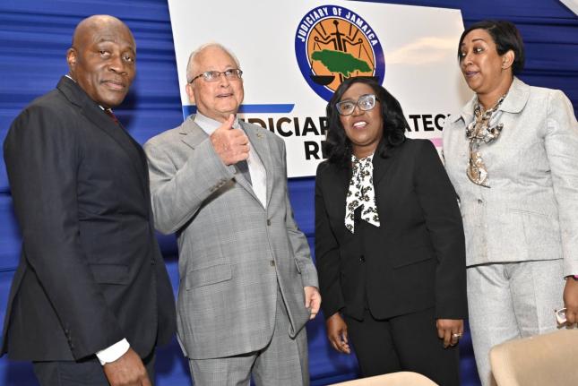 Delroy Chuck (second left), Minister of Justice and Constitutional Affairs, chats with (from left) Justice Bryan Sykes, Chief Justice of Jamaica; Trecia Cameron Anglin, Director/CEO of the Court Administration Division; and Justice Simone Wolfe Reece, Seni