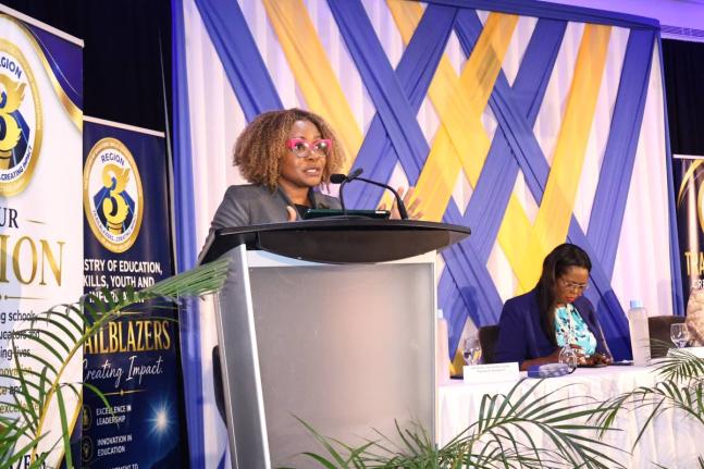 Minister of Education, Skills, Youth and Information, Senator Dr Dana Morris Dixon (at podium), addresses the ministry's Region Three Back-To-School Leadership Summit for Principals and School Board Chairs at Ocean Coral Spring Resort in Coral Spring, Trel