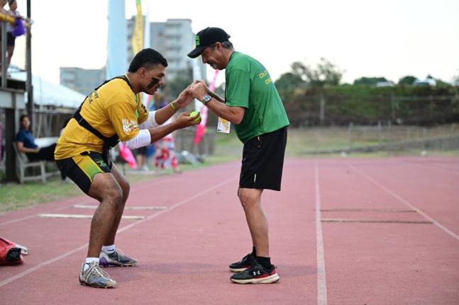 Nate McPeak (left), goalkeeper for the Jamaica Lacrosse team, goes through reflex conditioning ahead of the match against the United States in the Pan American Lacrosse Championships on Wednesday.