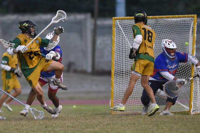 Hayden Hiltz (left) from Jamaica scores against Puerto Rico in the 2026 Pan-American Men's Lacrosse Championship at the Stadium East field on Friday. – Ian Allen photo 
