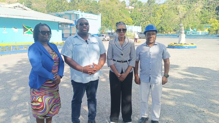 Parliamentary Secretary in the Ministry of Education, Skills, Youth and Information, Senator Marlon Morgan (second left), engages with stakeholders at the Ocho Rios Primary School in St Ann on Monday, August 24. Looking on is Principal Suzette Barnes-Wilso