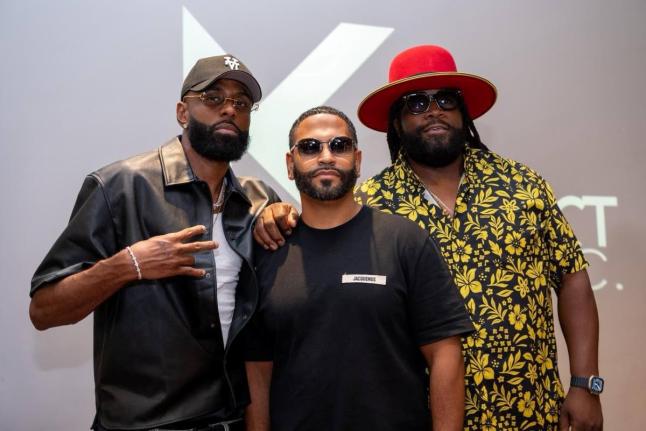 BZR WKND promoters Ryan Burke (left) and Gramps Morgan (right) flank Kelvin Santiago during the August BZR WKND launch. 