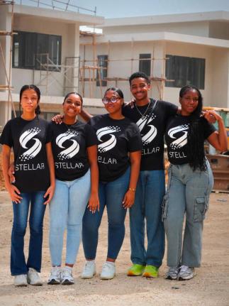 Romulus Deenah (second right) is flanked by Mount Alvernia High School students participating in the Stellar Foundation programme (from left), Bethany Davis, Tiffany Banner, Kiyoshi Robinson and Rajhni Raxton, during a visit to the One Reading construction