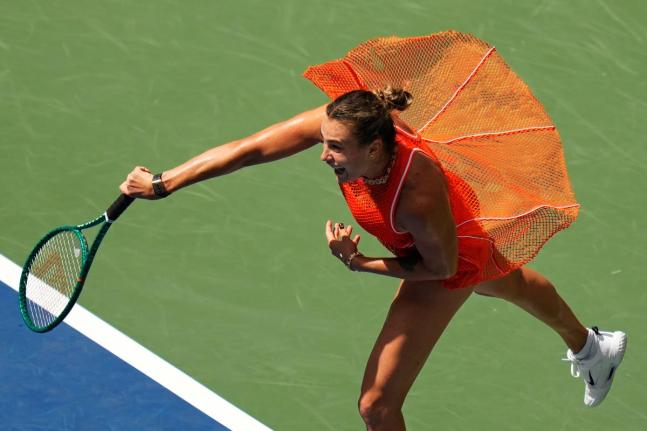 Aryna Sabalenka, of Belarus, follows through on a shot to Camila Osorio, of Colombia, during the first round of the U.S. Open tennis championships, yesterday, in New York. 