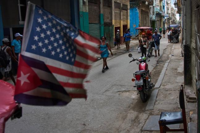 People walk on the street during a blackout in Havana, Cuba, Monday, July 6, 2026. (AP Photo/Ramon Espinosa)