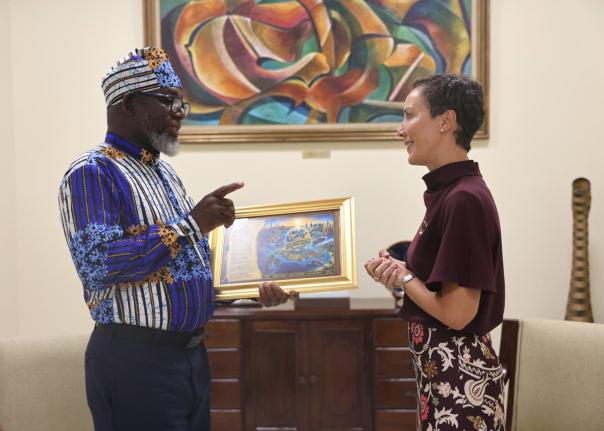 
Garfield Angus, senior Journalist at the Jamaica Information Service, speaks with Senator Kamina Johnson Smith, minister of foreign affairs and foreign trade, during the presentation of his narrative poem, ‘Out Of Many, One Global Family: The Diaspora R