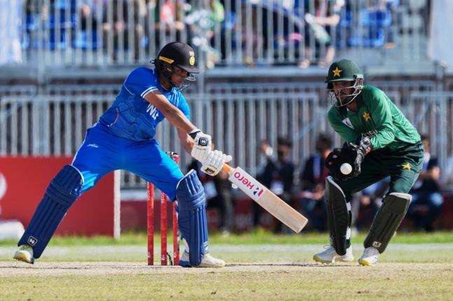 
India’s Abhishek Sharma (left) hits a shot during the gold medal cricket match against Pakistan at the Asian Games in Nagoya, Japan, yesterday.