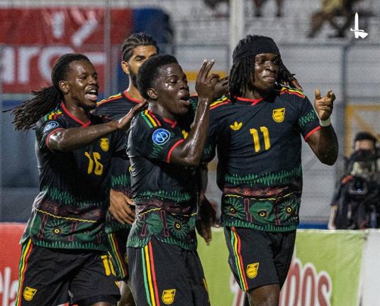 Jamaica’s Tyreece Campbell (right) celebrates scoring against Honduras on Monday.