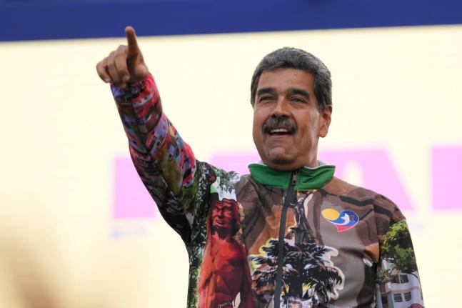 FILE - Former Venezuelan President Nicolas Maduro points to supporters during a campaign rally in the Catia neighbourhood of Caracas, Venezuela, July 18, 2024. (AP Photo/Matias Delacroix, File)