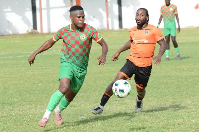 Suejay Graham (left) of Humble Lion and  Ajuma Johnson of Tivoli Gardens battle for the ball during their Jamaica Premier League match at the Edward Seaga Sports Complex on Sunday, September 13, 2026.