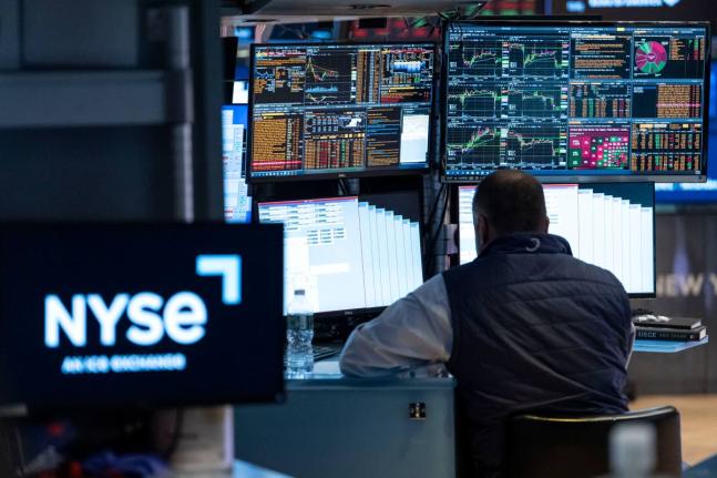 Specialist Dilip Patel works on the floor of the New York Stock Exchange, Thursday, Oct. 8, 2026, in New York. (AP Photo/Yuki Iwamura)