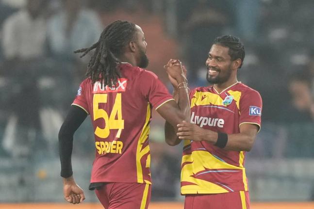 West Indies’ Keemo Paul (right) and Shamar Springer celebrate after their team won the fourth T20 cricket match against India in Hyderabad, India, on Wednesday.