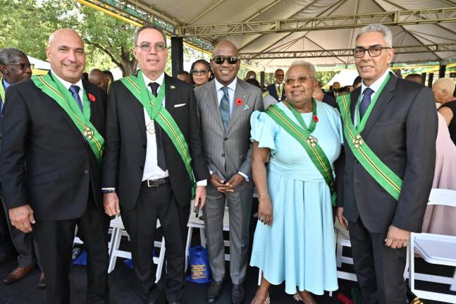 The newest members of the Order of Jamaica (from left) Christopher Zacca; Daryl Vaz; Duane Smith (representing his father Derrick Smith); Maxine Henry-Wilson; and Richard Byles, at the National Honours and Awards Investiture Ceremony held yesterday on the 