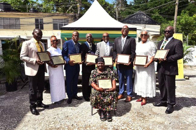 Recipients of Hanover’s National Heroes Day awards are (from left) Horace Thompson, Dr Valrie Miller, Stennett Rowe, Rev Sheldon Sean Ashman, Vernon Fletcher, Moncrieffe Leslie, Hyacinth Shakes-Warren, and Delroy Pinnock. Seated is Hyacinth Whyte-McKenzi
