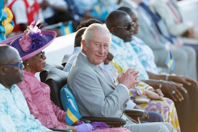 Britain’s King Charles III watches a youth performance at The Future Bahamas Youth Rally and Exhibition at Clifford Park in Nassau, Bahamas, Tuesday, Oct. 27, 2026.