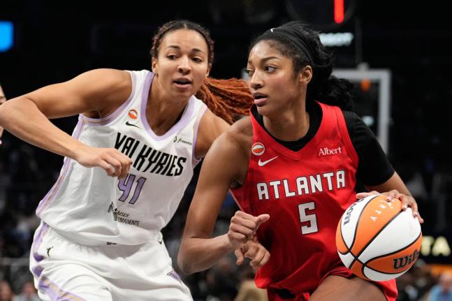 Atlanta Dream’s Angel Reese (5) goes up to shoot against Golden State Valkyries’ Kiah Stokes during the second half of Game 6 of the WNBA basketball finals on Thursday, October 29, in Atlanta. 