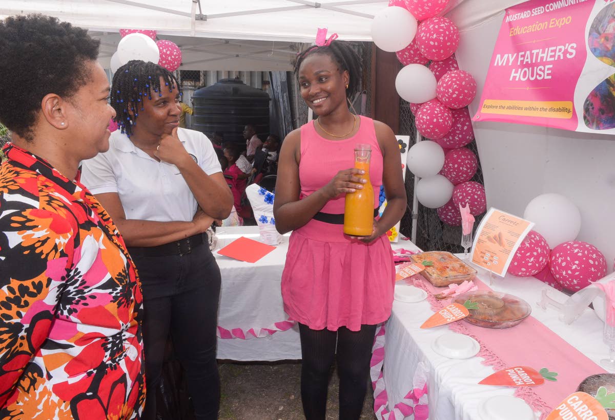 Special Needs Coordinator at the Ministry of Education, Skills, Youth and Information, Nicolette Thompson (left), and Children’s Officer at the Child Protection and Family Services Agency (CPFSA), Jesanya Scale-Menzies (centre), listen attentively as Car