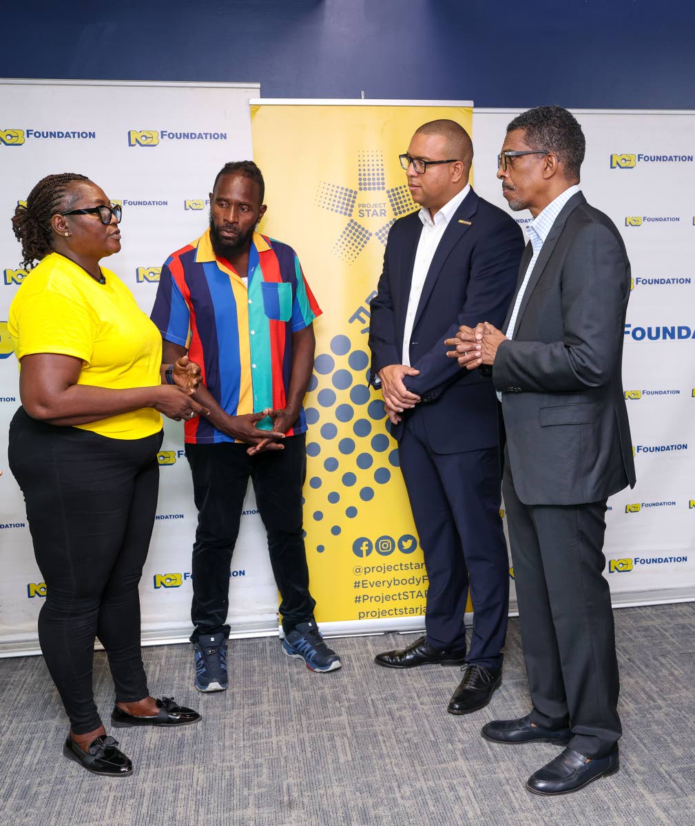 Community leader Patricia Durrant-Young (left), shares her experience with Project STAR’s impact in Parade Gardens, as resident Kevin Josephs (second left), Perrin Gayle (second right), CEO of NCB Foundation, and Ian Neita, chair of Project STAR’s Moni