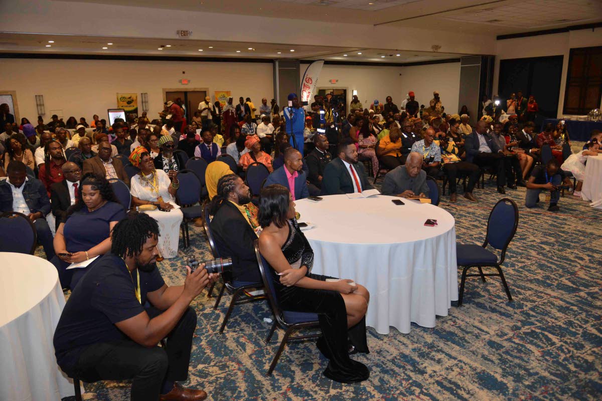 Specially invited guests and attendees listening attentively.