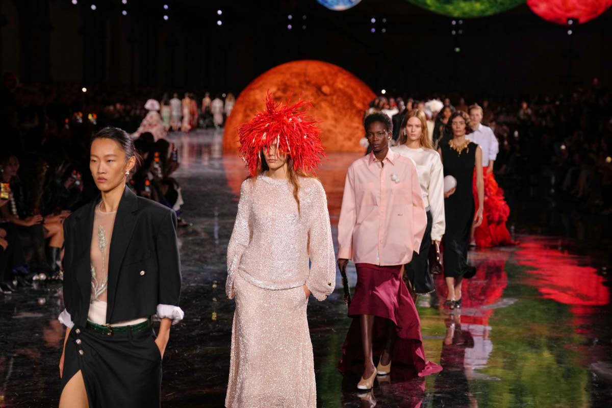 Models wear cropped suits and feather-light pieces from Chanel’s Spring/Summer 2026 collection in Paris, marking the house’s lighter take on classic tailoring.