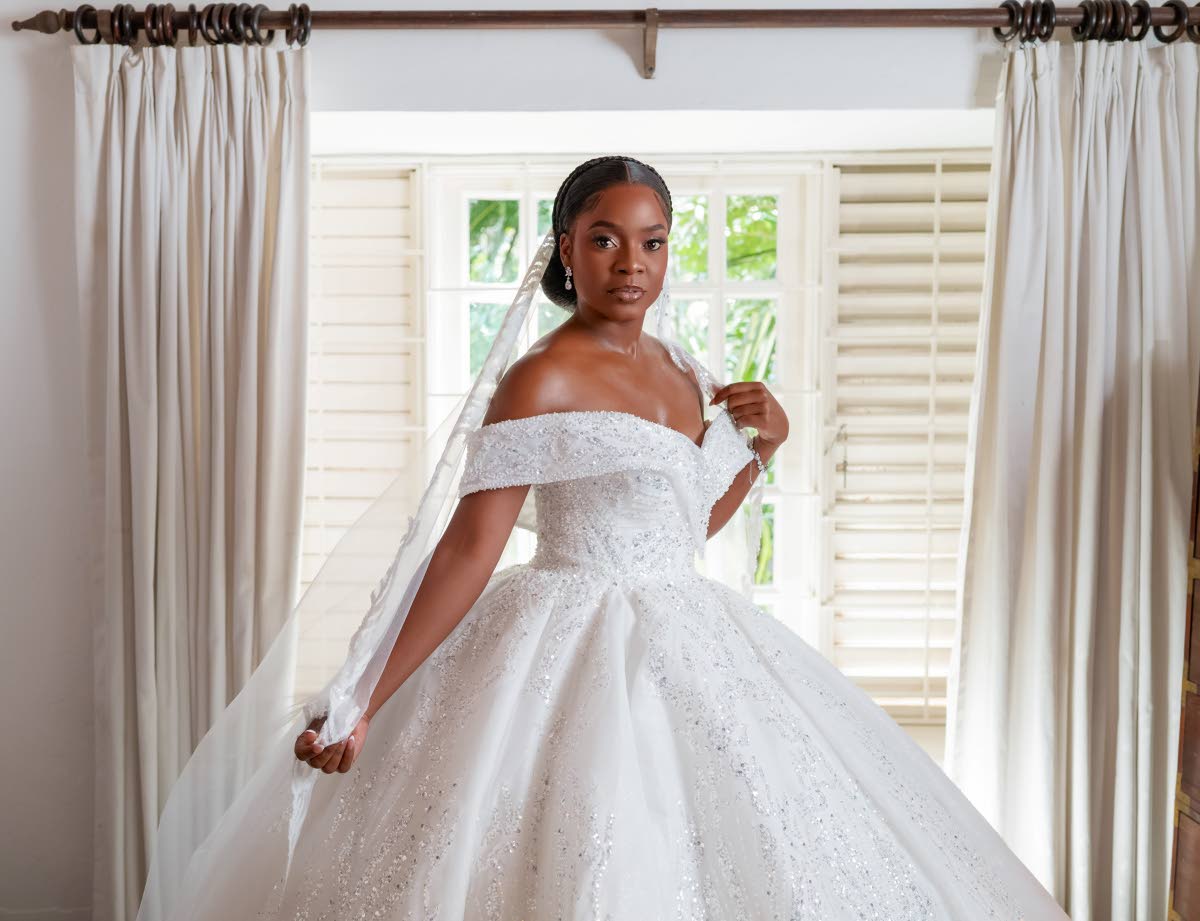 The beautiful bride, Sherona Forrester-Thomas, stuns in a gown from local bridal boutique The Sweetest Weddings Jamaica.