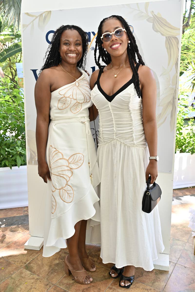 Danielle Douglas (left), general manager of Post-to-Post Betting, is all smiles with Yeuniek Hinds, director of Jamaica Special Economic Zone Authority.