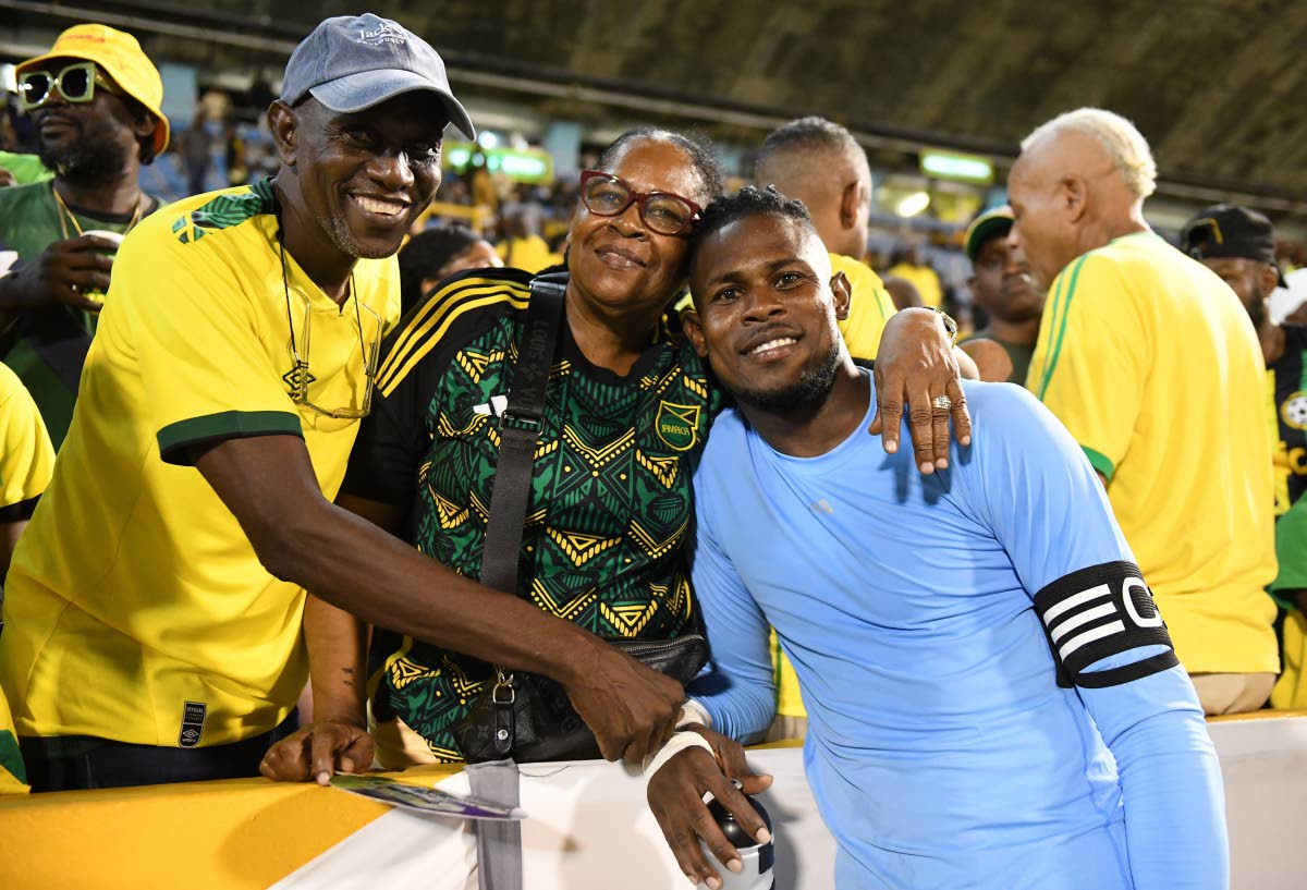 Reggae Boyz Captain Andre Blake (right) with parents George (left) and Coreen Blake.