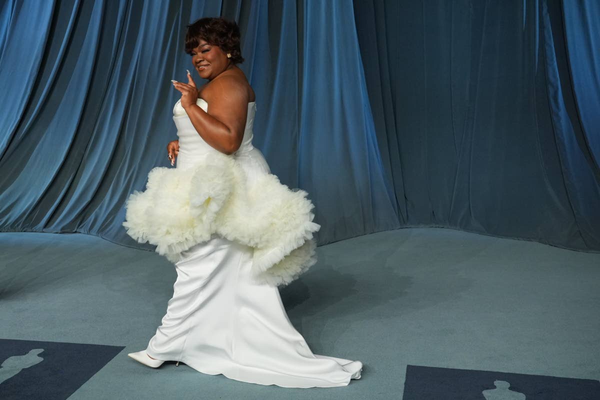 Da’Vine Joy Randolph gives old Hollywood glamour in a white off-the-shoulder gown. 