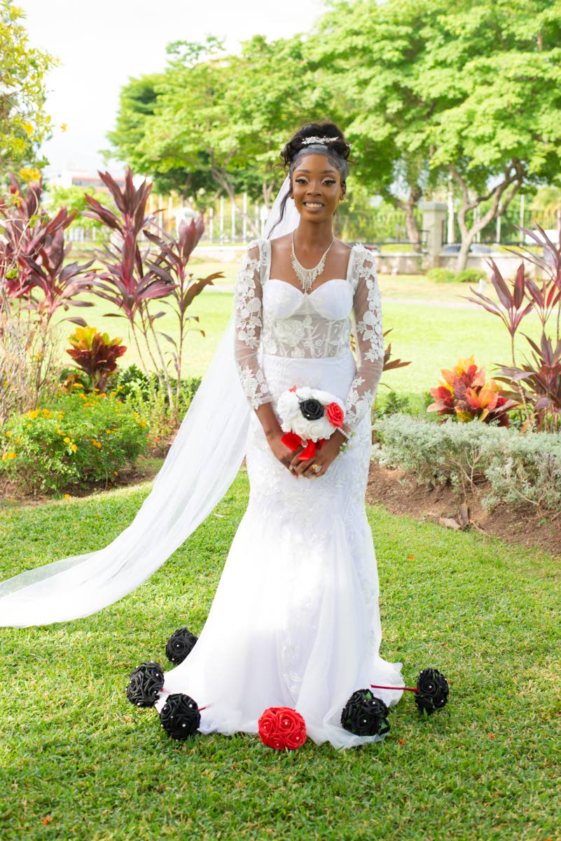 The beautiful bride in her customised floral lace gown.