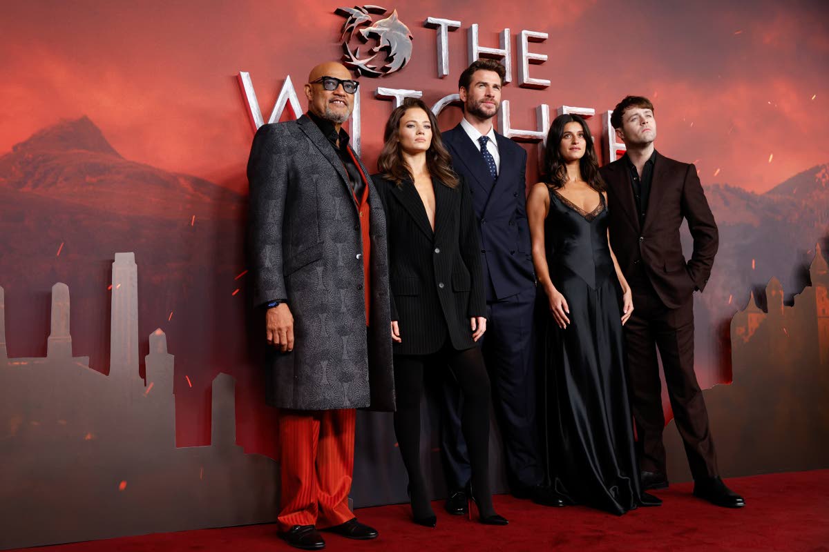 Cast members (from left) Laurence Fishburne, Freya Allen, Liam Hemsworth, Anya Chalotra, and Joey Batey, pose for photographers upon arrival at the global premiere of season four of ‘The Witcher’ in London on Thursday.