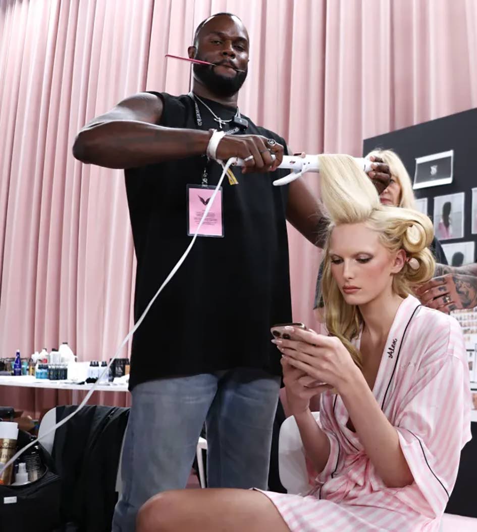 Jamaican-American celebrity hairstylist Jawara Wauchope tends to the tresses of supermodel Alex Consani backstage at the 2025 Victoria’s Secret Fashion Show.