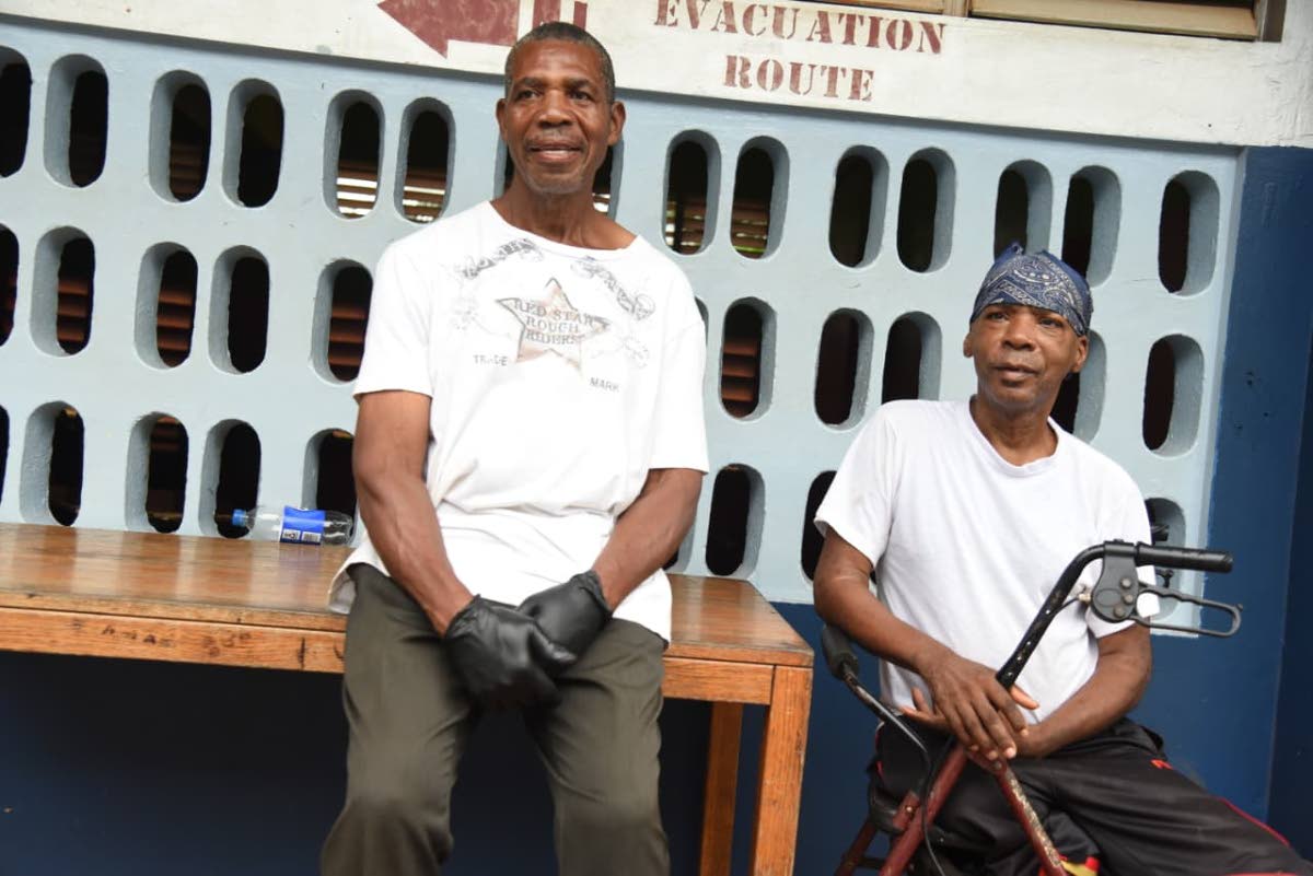  Jewham Davis Davis (left) and Trevor Barnes are two of the three persons presently staying in the shelter at the New Forest High School in Manchester on October 26, 2025. 