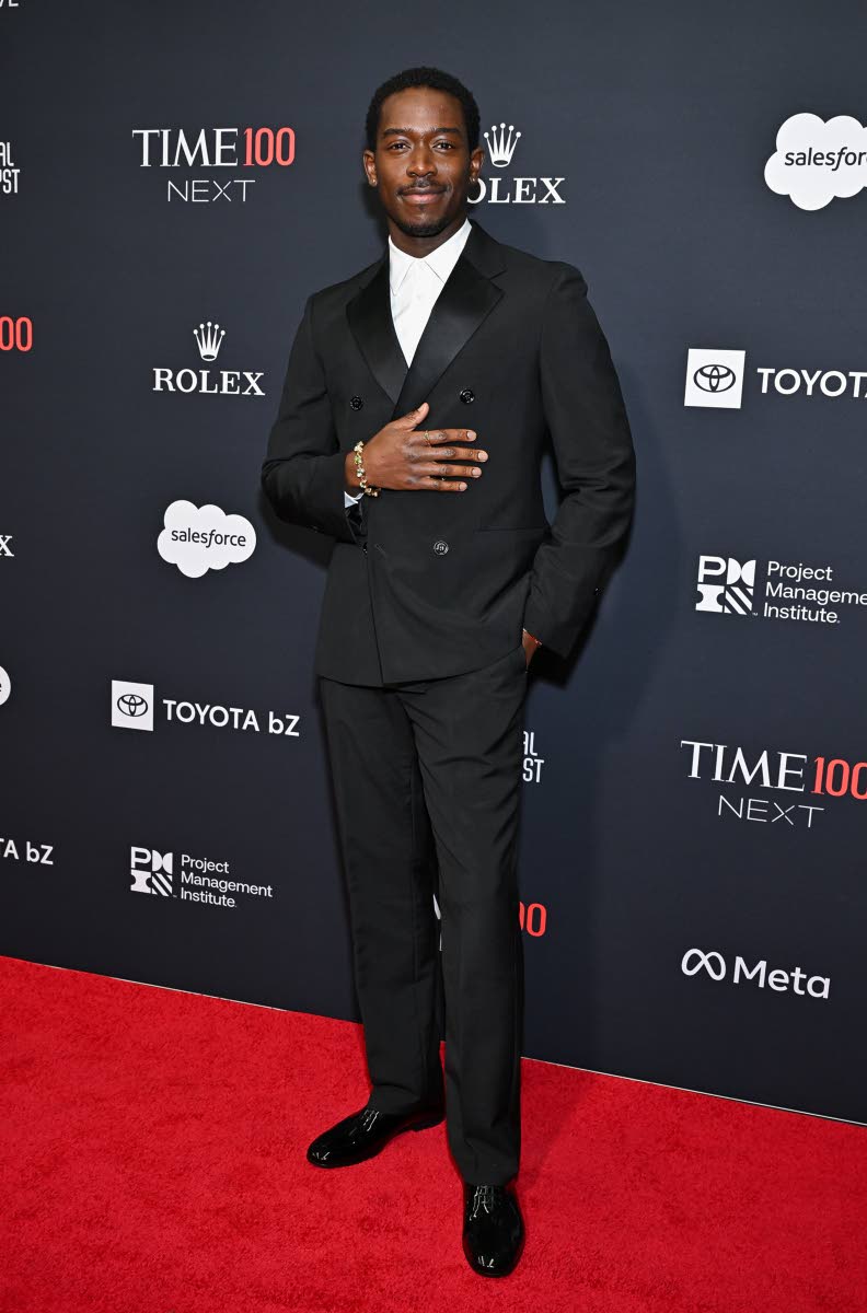 Left: Damson Idris made classic look cool again in Ferragamo, finishing the look with statement pieces from his DIDRIS jewellery line.