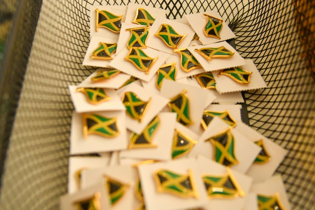 Jamaican flag pins are now on display for purchase.