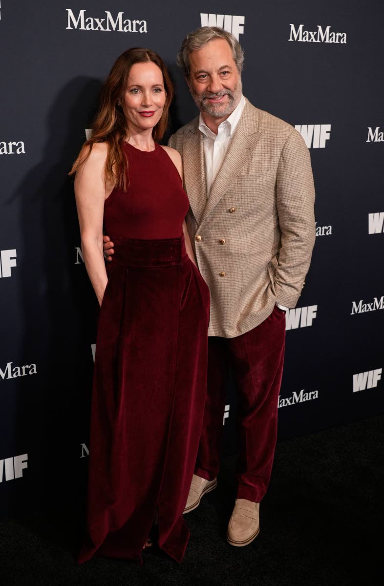 Writer and director Judd Apatow (right) and his wife, actress Leslie Mann, pose together at the 2025 Women in Film Honors on Thursday, where daughter Maude Apatow received the Max Mara Face of the Future Award.