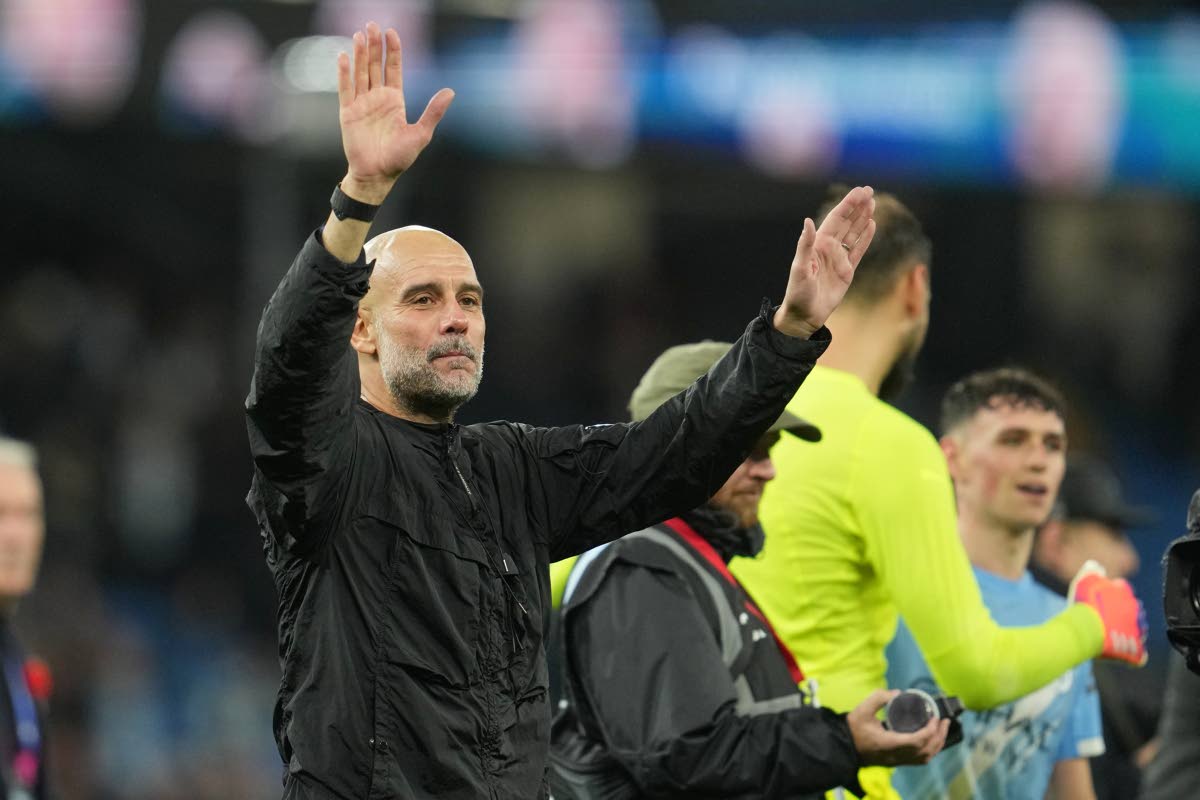 Manchester City’s head coach Pep Guardiola leaves the field at the end of the English Premier League  match between Manchester City and Liverpool in Manchester, England, yesterday.