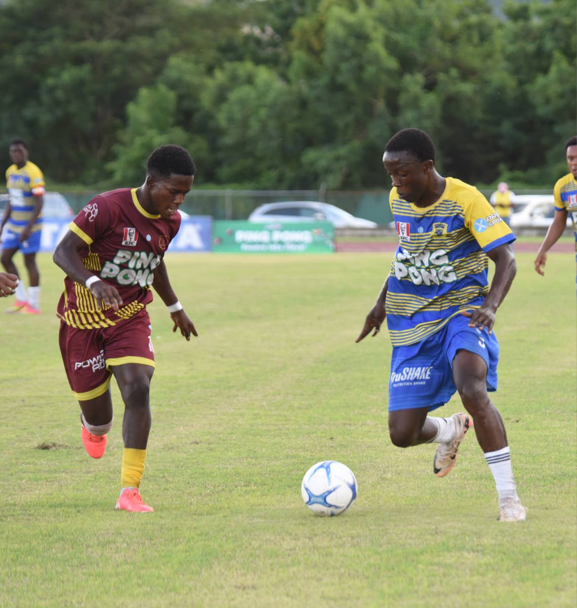 Maggotty High School’s Roshane Lewis (left) keeps a close eye on  Rusea’s High School’s Omarion Jemmison during a daCosta Cup game at thee Montego Bay Sports Complex on October 11.